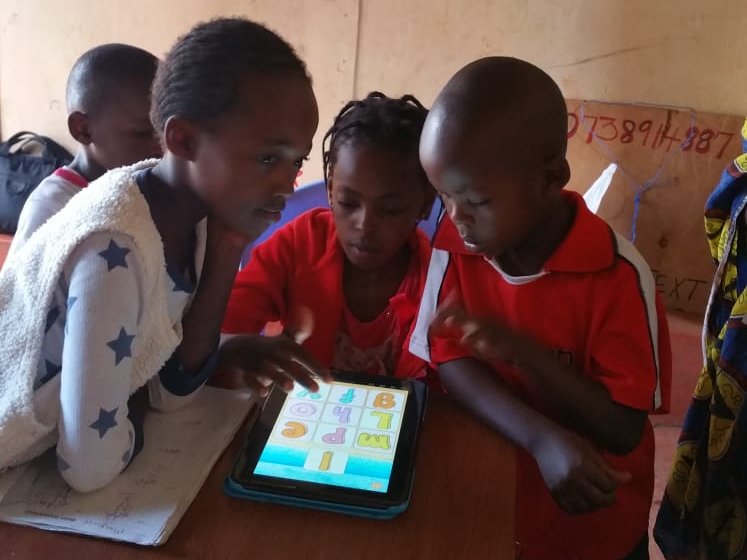 children learning via a tablet