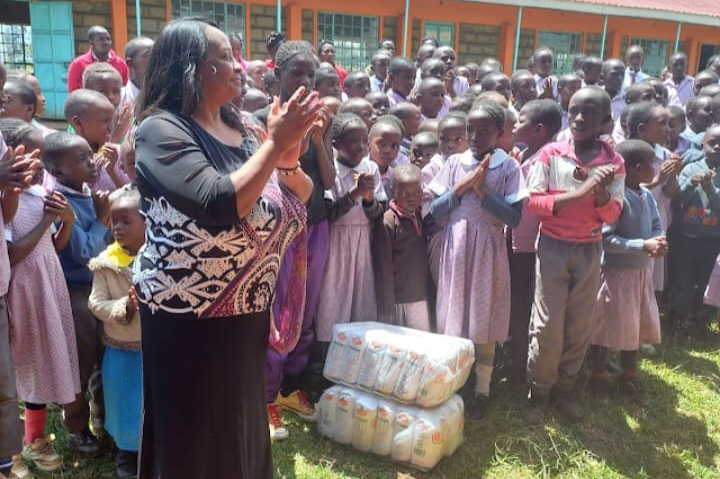 Our Treasurer with Children at Wendiga Primary School
