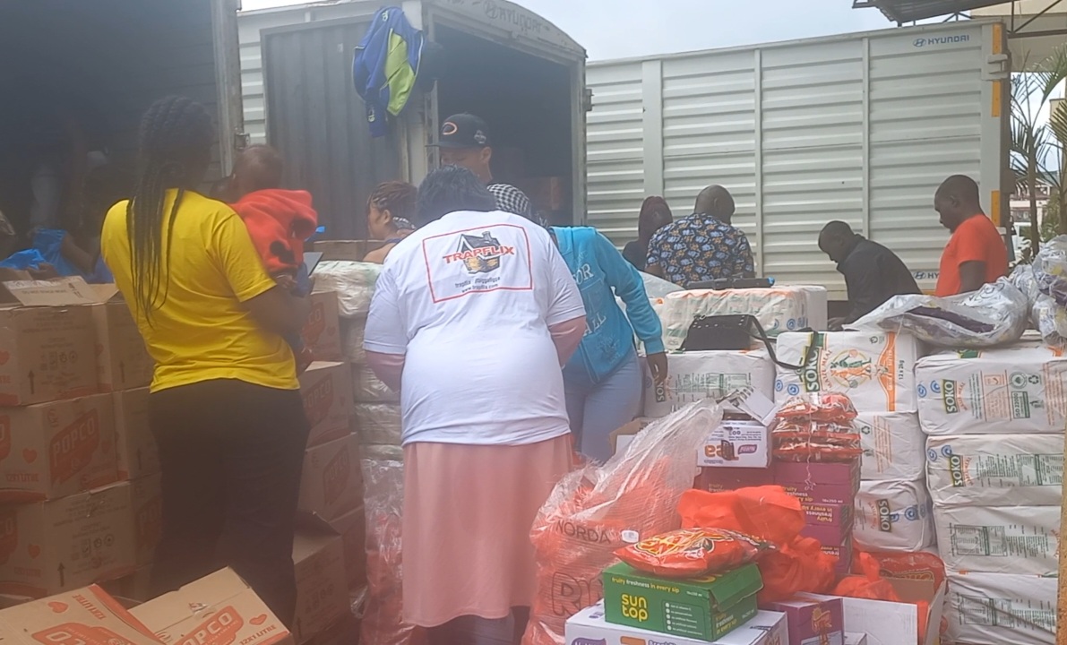 Sponsors and coordinators packing food for the second giveaway at Kangemi slums